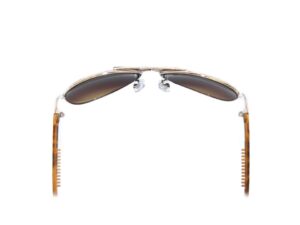 A pair of sunglasses with a brown frame and a white lens.