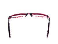 A pair of glasses with red frames and black rims.